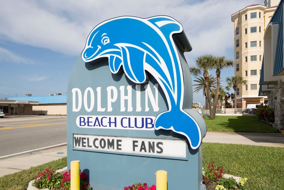 dolphin beach club sign